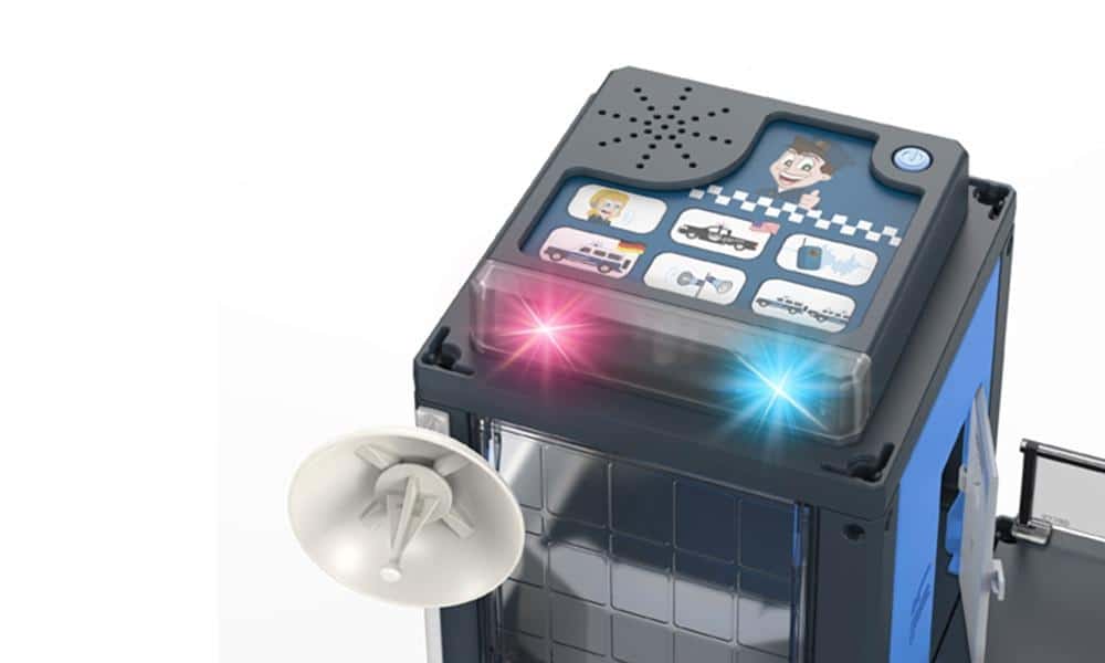 Police station toy building with flashing lights and rooftop siren, blue and gray