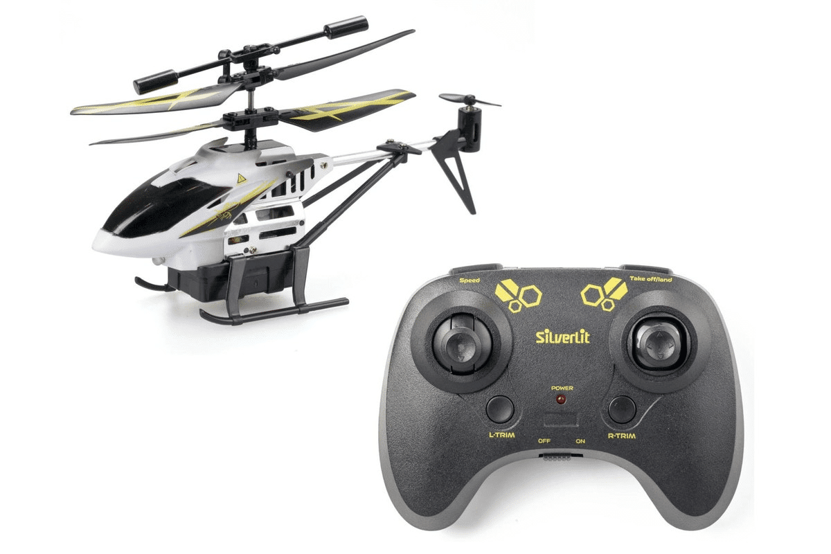 White and yellow RC helicopter with rotor blades and skids, with remote controller