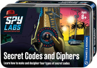 Spy Labs tin, colorful cover with lighthouse scene, cipher wheel graphic and “Secret Codes and Ciphers”