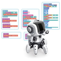 White and black coding robot with glowing screen elements and wheel feet, front view.