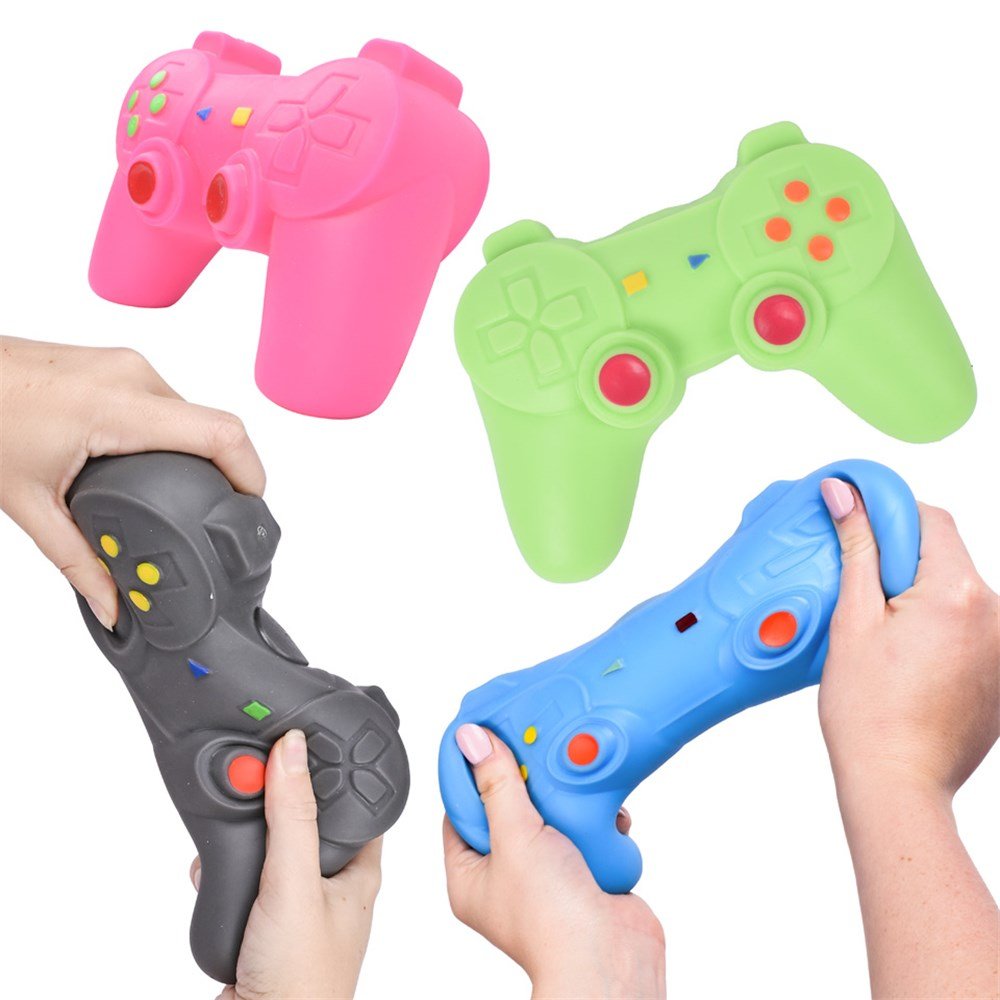 Squishy game controller toys held in hands: pink, green, gray, and blue
