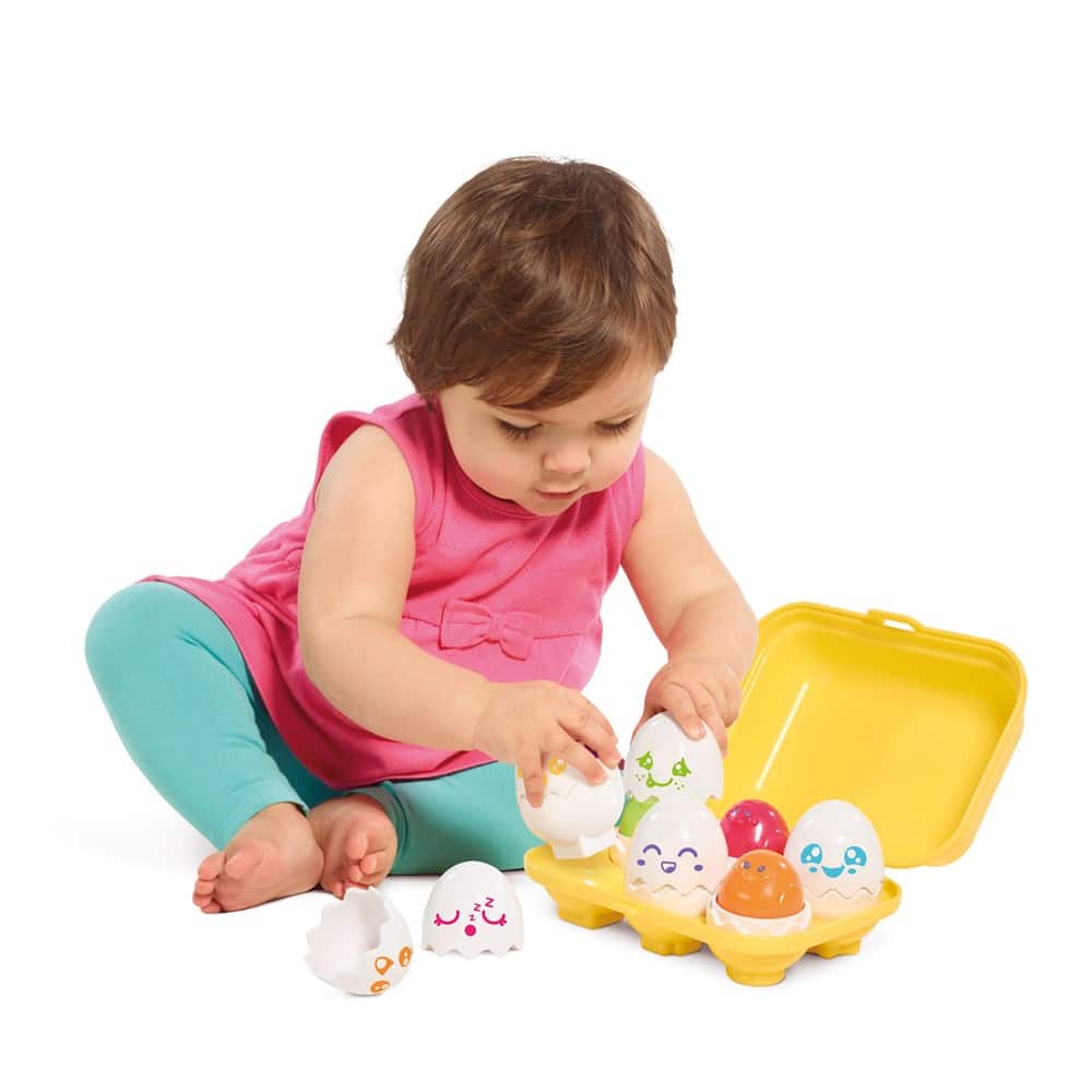 Squeaky egg toy set with yellow tray and cute character face eggs