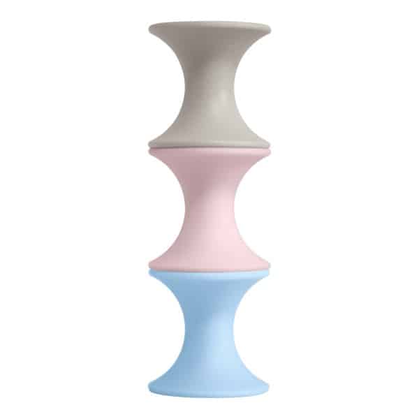 Moluk Tulu stacking toy set, three pastel hourglass pieces in gray, pink, blue
