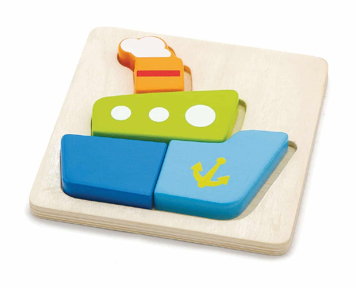 Mini block boat puzzle with blue and green pieces on a wooden base