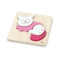 Cat-shaped wooden block puzzle with pink body and white face on light board