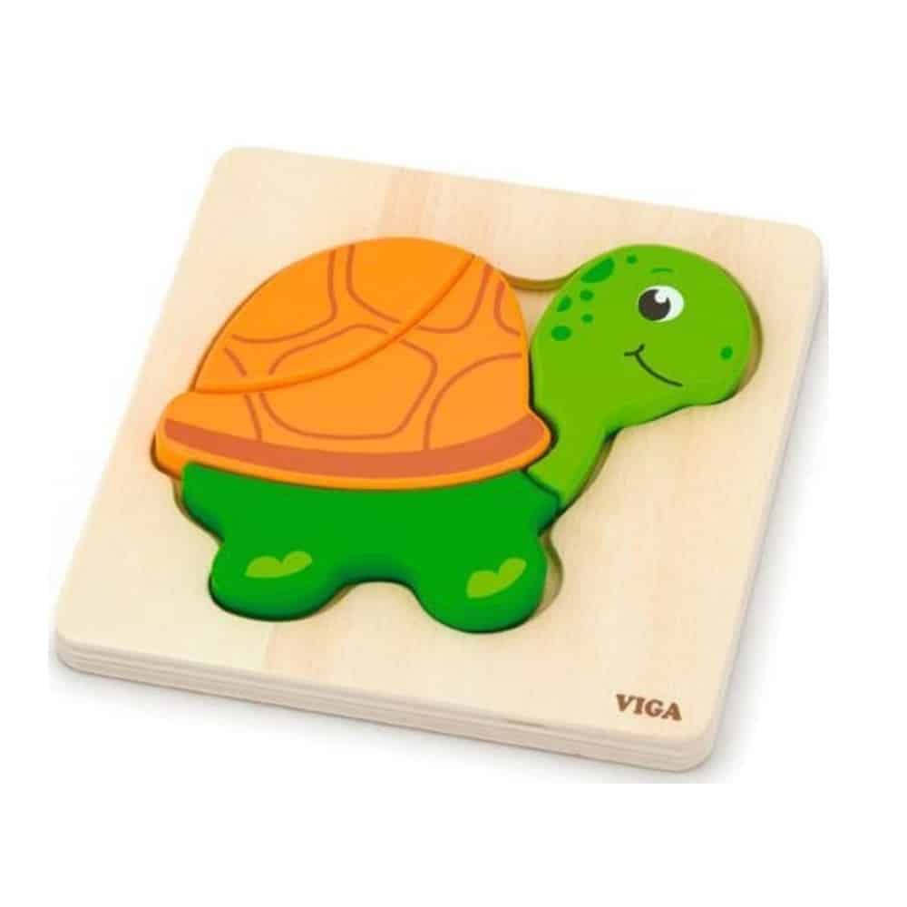 Turtle mini block puzzle with green body and orange shell on a wooden board