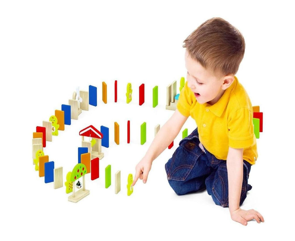 Wooden domino run set with colorful wooden blocks and dominos, set up for play