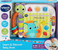 Boxed baby learning book with green character, numbered buttons 1-3, fish and ball
