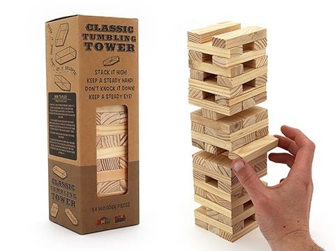 Wooden tumbling tower game box with stacked wooden blocks and hand