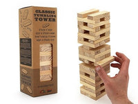 Wooden tumbling tower game box with stacked wooden blocks and hand