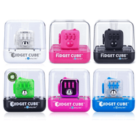 Assorted fidget cubes in clear boxes, showing multiple colors and spinner dials